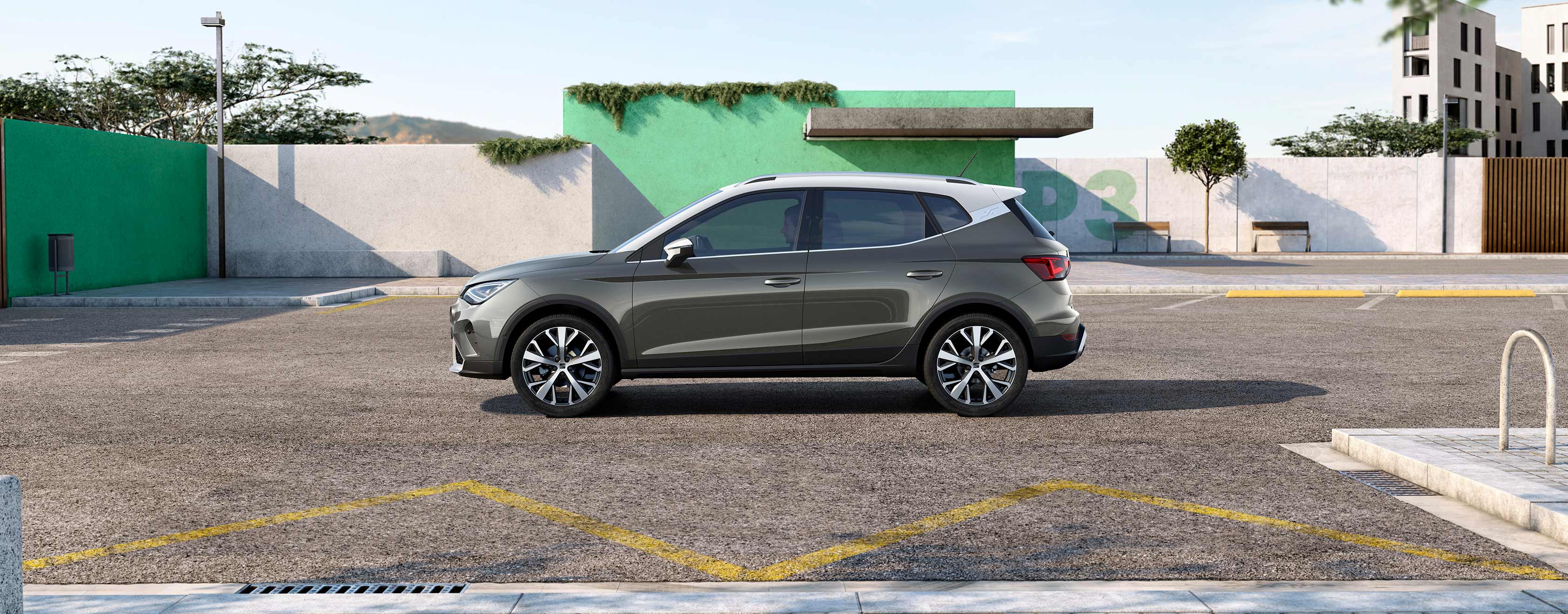 Rear view of the SEAT Arona dark camouflage colour with candy white roof